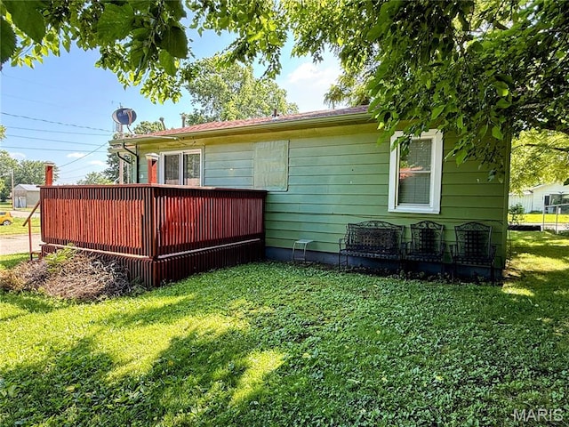 169 Grand Ave, Lebanon, MO 65536 - rear view of property with a yard and a wooden deck