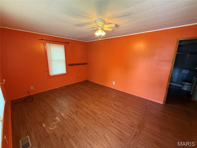 169 Grand Ave, Lebanon, MO 65536 - spare room featuring crown molding, ceiling fan, and wood finished floors