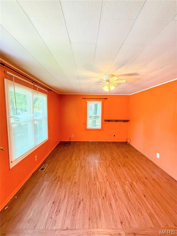 169 Grand Ave, Lebanon, MO 65536 - empty room featuring light wood finished floors and ceiling fan