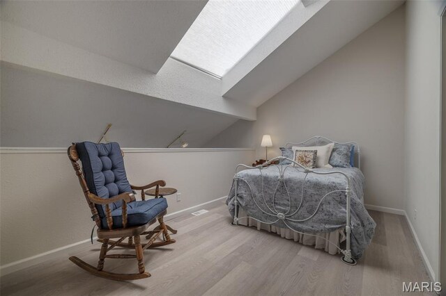 15 Lionshead Ridge Dr Unit 15, Innsbrook, MO 63390 - bedroom featuring wood finished floors, a skylight, and vaulted ceiling