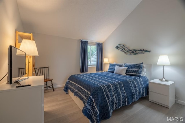15 Lionshead Ridge Dr Unit 15, Innsbrook, MO 63390 - bedroom with light wood finished floors and lofted ceiling