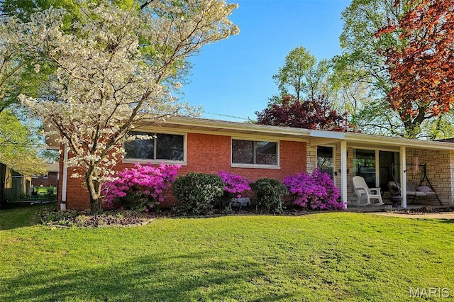 49 Bedford Dr, Belleville, IL 62226 - ranch-style house with a front lawn and brick siding