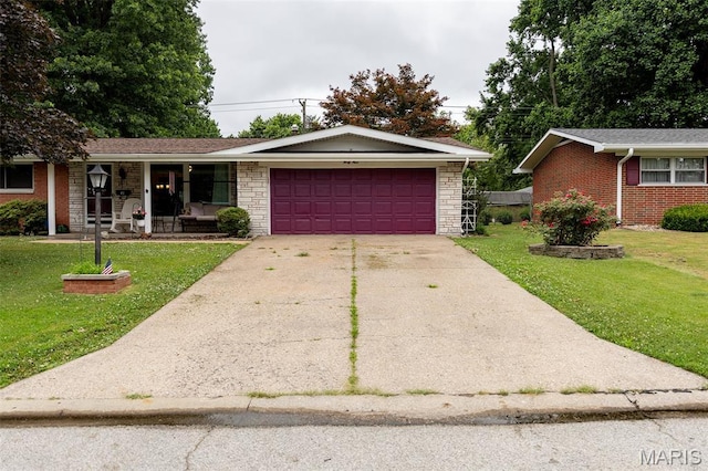 49 Bedford Dr, Belleville, IL 62226 - ranch-style house with a garage, a front lawn, concrete driveway, and covered porch