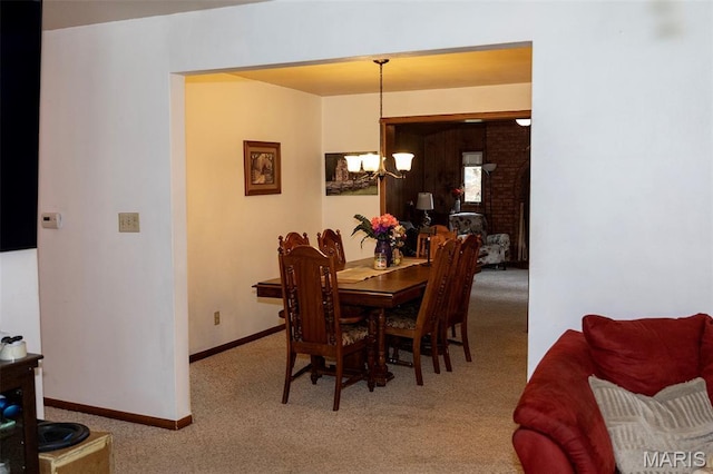 49 Bedford Dr, Belleville, IL 62226 - carpeted dining area featuring a chandelier and baseboards