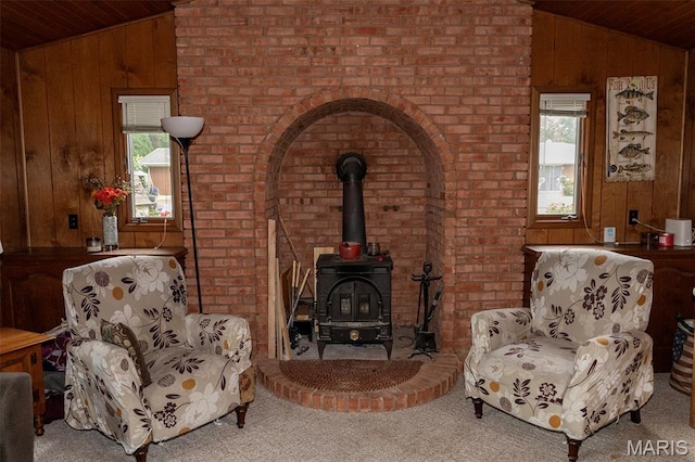 49 Bedford Dr, Belleville, IL 62226 - living area with wood ceiling, vaulted ceiling, wooden walls, plenty of natural light, and a wood stove