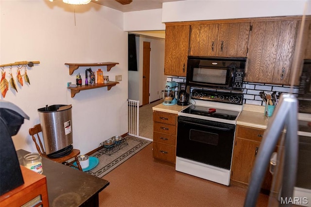 49 Bedford Dr, Belleville, IL 62226 - kitchen featuring electric range, black microwave, brown cabinets, a ceiling fan, and light countertops