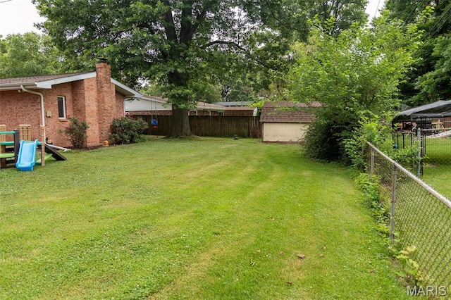 49 Bedford Dr, Belleville, IL 62226 - fenced backyard featuring a storage shed