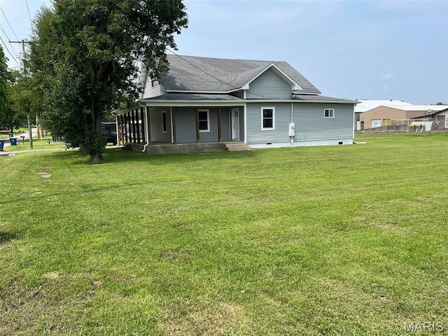 302 State St, Scott City, MO 63780 - view of front of home with a front yard, covered porch, and roof with shingles