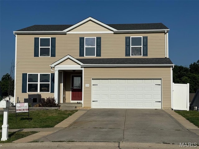 704 Rabbit Run Dr, Wentzville, MO 63385 - traditional-style house featuring a garage and concrete driveway