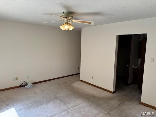7 Forest Hills Dr, Washington, MO 63090 - spare room featuring carpet floors and a ceiling fan
