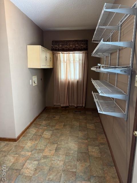 7 Forest Hills Dr, Washington, MO 63090 - washroom with cabinet space, washer hookup, and a textured ceiling
