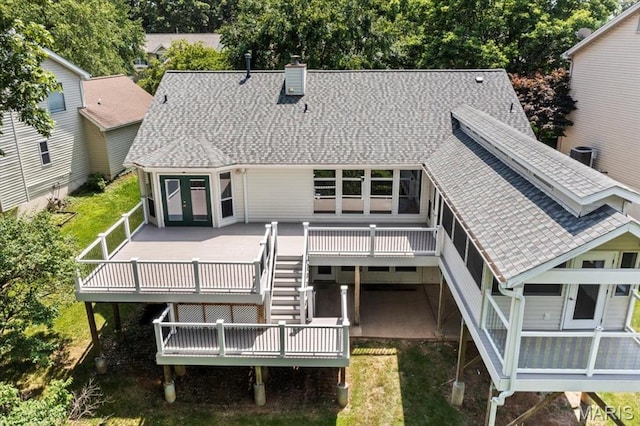 510 Wetherby Terrace Dr, Ballwin, MO 63021 - back of property featuring a chimney, a shingled roof, a deck, stairs, and french doors