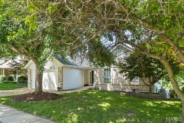 510 Wetherby Terrace Dr, Ballwin, MO 63021 - obstructed view of property with a garage, a front yard, driveway, and brick siding