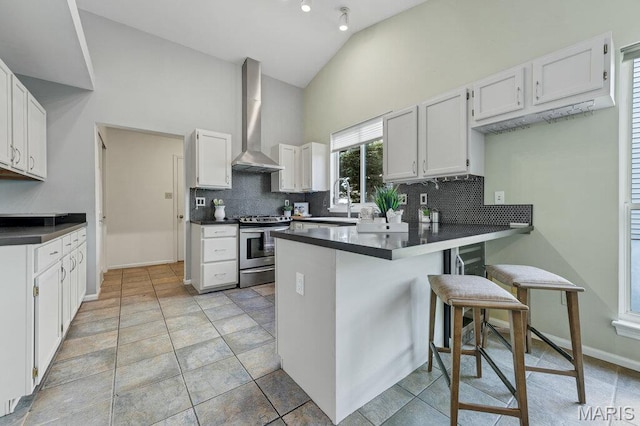 510 Wetherby Terrace Dr, Ballwin, MO 63021 - kitchen featuring electric range, wall chimney range hood, a peninsula, high vaulted ceiling, and backsplash