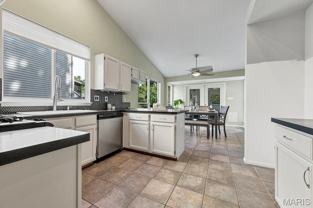 510 Wetherby Terrace Dr, Ballwin, MO 63021 - kitchen featuring stainless steel dishwasher, vaulted ceiling, dark countertops, a peninsula, and ceiling fan