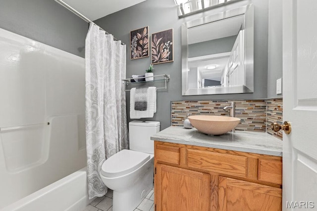 510 Wetherby Terrace Dr, Ballwin, MO 63021 - bathroom featuring vanity, tasteful backsplash, tile patterned flooring, and shower / tub combo