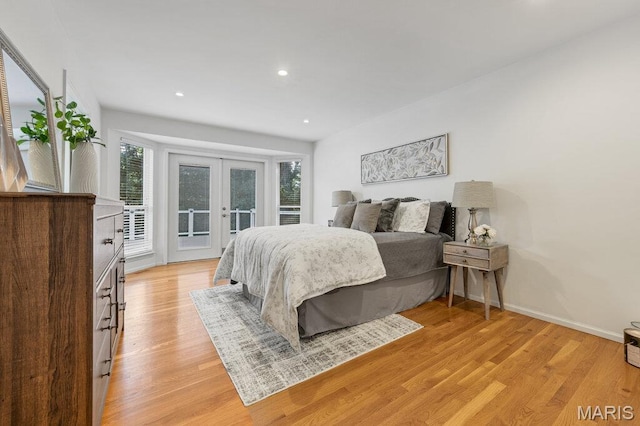 510 Wetherby Terrace Dr, Ballwin, MO 63021 - bedroom with access to exterior, french doors, light wood-style flooring, and recessed lighting
