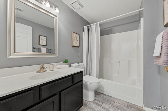 510 Wetherby Terrace Dr, Ballwin, MO 63021 - full bath with vanity, wood finished floors, and shower / bathtub combination with curtain
