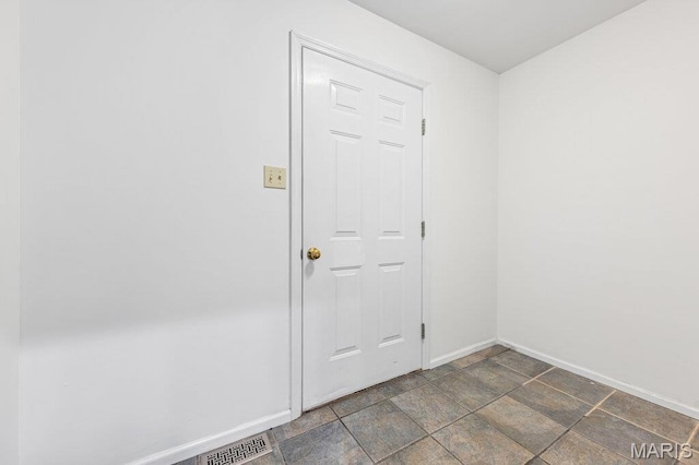 510 Wetherby Terrace Dr, Ballwin, MO 63021 - unfurnished room with baseboards and stone finish floors