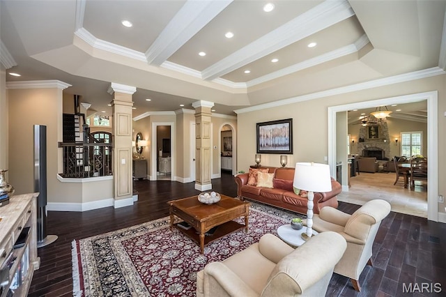 21 Lynnbrook Rd, Saint Louis, MO 63131 - living room featuring decorative columns, crown molding, dark wood-type flooring, arched walkways, and recessed lighting