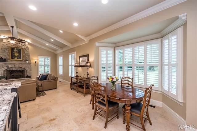 21 Lynnbrook Rd, Saint Louis, MO 63131 - dining space with a fireplace, plenty of natural light, a ceiling fan, recessed lighting, and crown molding