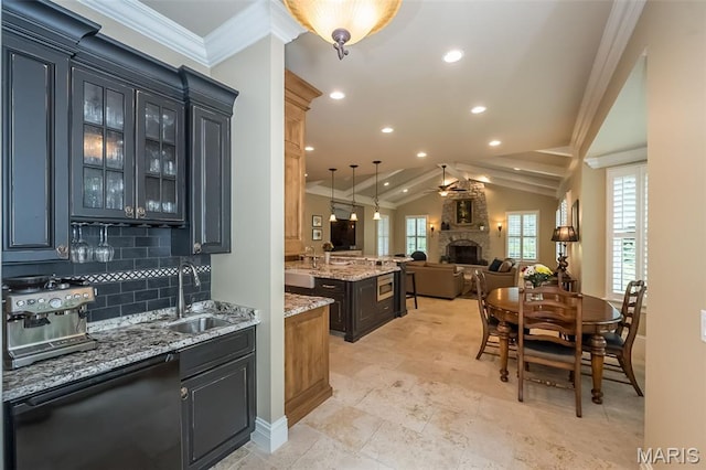 21 Lynnbrook Rd, Saint Louis, MO 63131 - kitchen featuring a stone fireplace, open floor plan, a ceiling fan, tasteful backsplash, and glass insert cabinets