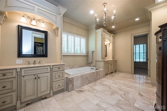 21 Lynnbrook Rd, Saint Louis, MO 63131 - full bathroom with healthy amount of natural light, two vanities, a chandelier, ornamental molding, and a bath