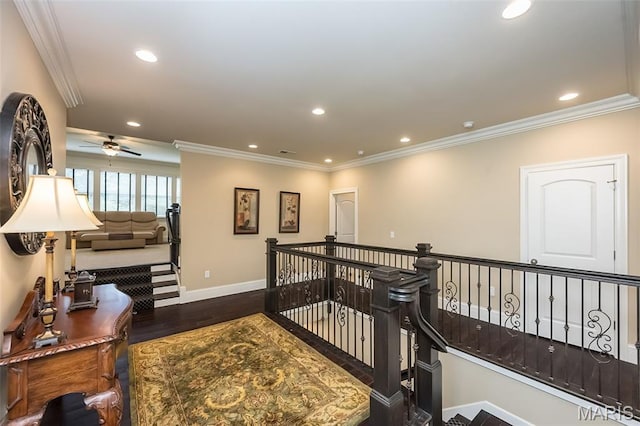 21 Lynnbrook Rd, Saint Louis, MO 63131 - hallway featuring wood finished floors, an upstairs landing, recessed lighting, and crown molding