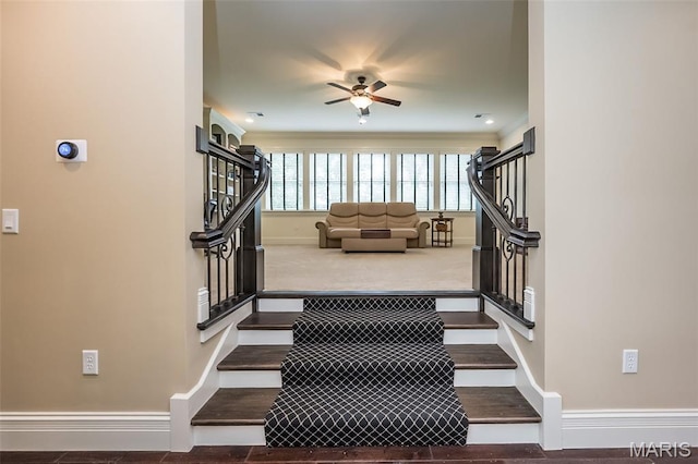 21 Lynnbrook Rd, Saint Louis, MO 63131 - staircase with ceiling fan and wood finished floors