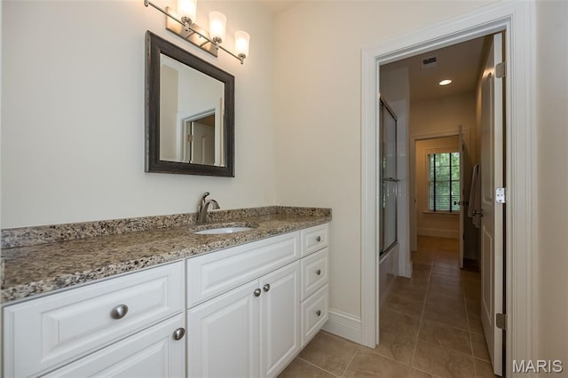 21 Lynnbrook Rd, Saint Louis, MO 63131 - bathroom with vanity, a shower with shower door, and tile patterned flooring