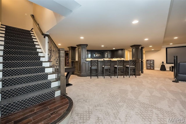 21 Lynnbrook Rd, Saint Louis, MO 63131 - interior space featuring decorative columns, stairway, and recessed lighting