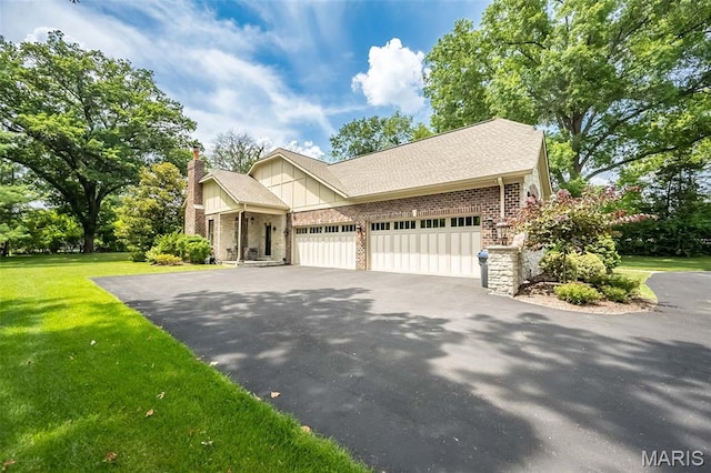 21 Lynnbrook Rd, Saint Louis, MO 63131 - view of front of property featuring driveway, brick siding, a front lawn, a chimney, and a garage