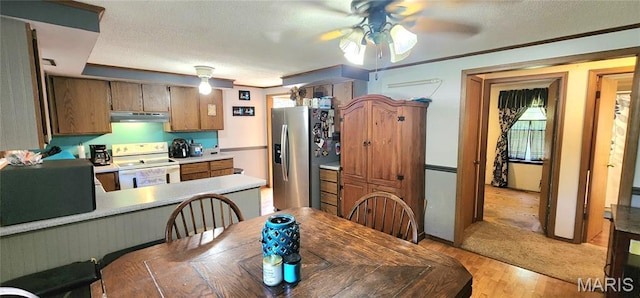 8739 Shawneetown Trl, Chester, IL 62233 - dining area featuring ceiling fan, light wood-type flooring, and a textured ceiling