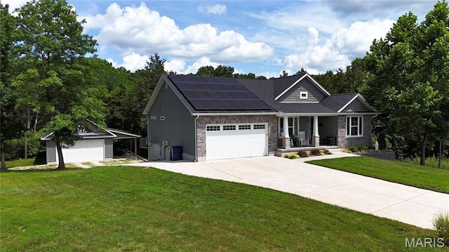 358 N Thomas St, De Soto, MO 63020 - craftsman-style home featuring a porch, solar panels, a front yard, an attached garage, and driveway