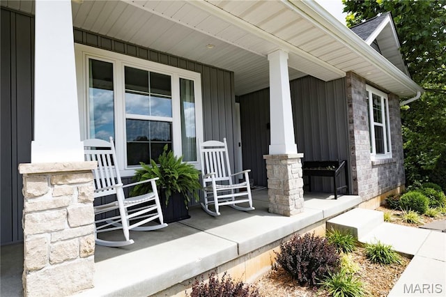 358 N Thomas St, De Soto, MO 63020 - entrance to property featuring a porch, stone siding, and board and batten siding