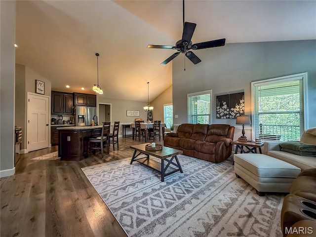 358 N Thomas St, De Soto, MO 63020 - living area with ceiling fan, high vaulted ceiling, wood finished floors, a chandelier, and recessed lighting