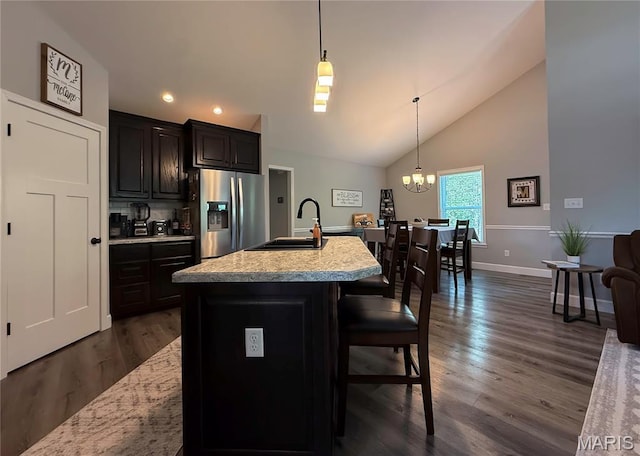 358 N Thomas St, De Soto, MO 63020 - kitchen featuring stainless steel fridge with ice dispenser, lofted ceiling, recessed lighting, pendant lighting, and a chandelier