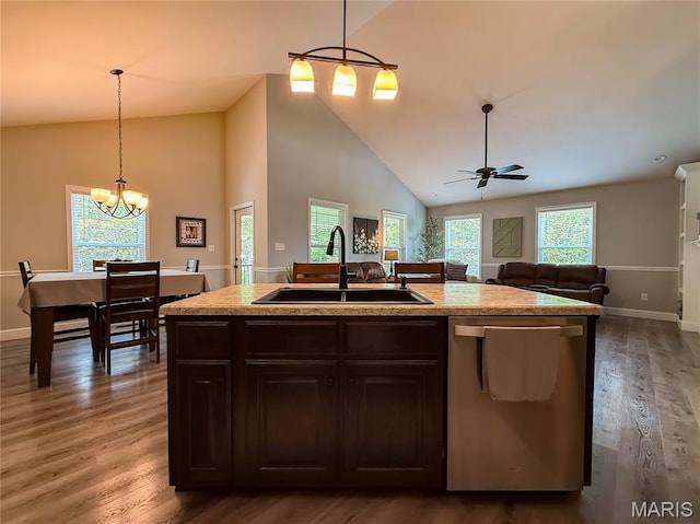 358 N Thomas St, De Soto, MO 63020 - kitchen with stainless steel dishwasher, high vaulted ceiling, wood finished floors, a chandelier, and light countertops