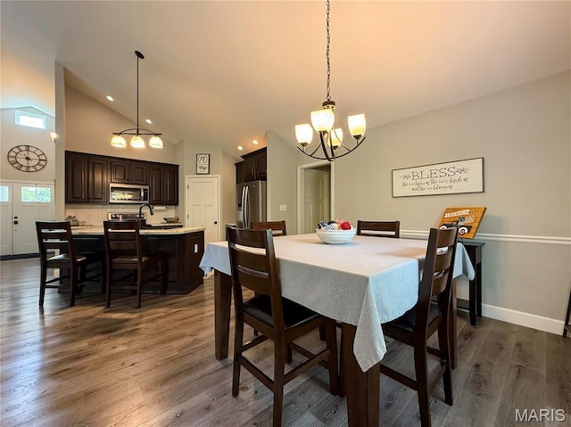 358 N Thomas St, De Soto, MO 63020 - dining space with a chandelier, dark wood-type flooring, recessed lighting, and high vaulted ceiling