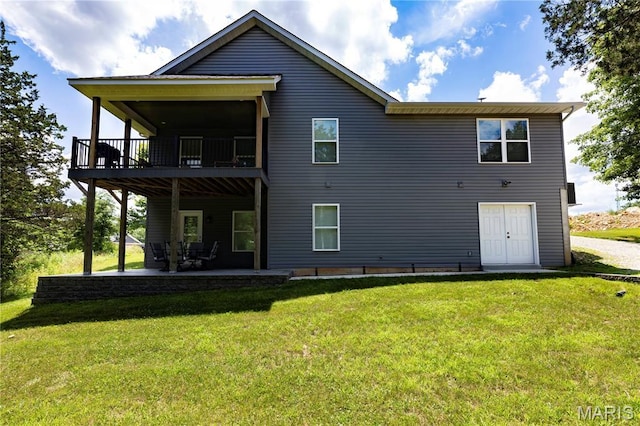 358 N Thomas St, De Soto, MO 63020 - back of property with a lawn and a patio