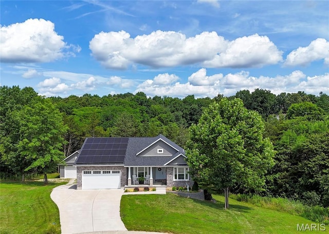 358 N Thomas St, De Soto, MO 63020 - view of front of house with covered porch, a front yard, solar panels, and driveway