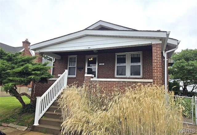 5425 Sunshine, Saint Louis, MO 63109 - view of front facade with brick siding and a porch