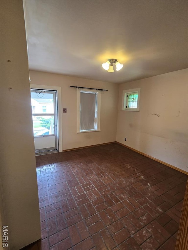 5425 Sunshine, Saint Louis, MO 63109 - spare room with brick flooring and baseboards