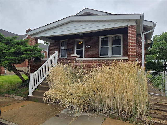 5425 Sunshine, Saint Louis, MO 63109 - view of front of home with brick siding, covered porch, and stairway