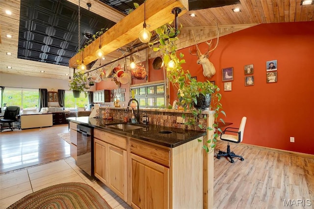 3204 Westwood Rd, Saint Clair, MO 63077 - kitchen with dishwasher, open floor plan, lofted ceiling, light brown cabinetry, and light wood-style flooring