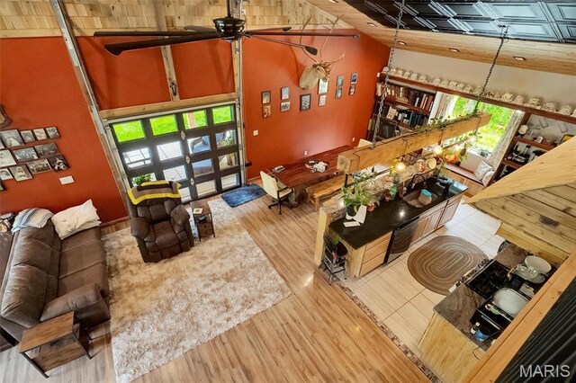 3204 Westwood Rd, Saint Clair, MO 63077 - living room featuring plenty of natural light, a ceiling fan, wood finished floors, a high ceiling, and french doors