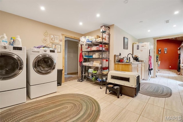 3204 Westwood Rd, Saint Clair, MO 63077 - laundry area with light tile patterned flooring, washing machine and dryer, and recessed lighting