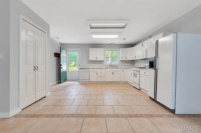 3080 Westwood Rd, Saint Clair, MO 63077 - kitchen with white appliances, light countertops, light tile patterned flooring, and white cabinets