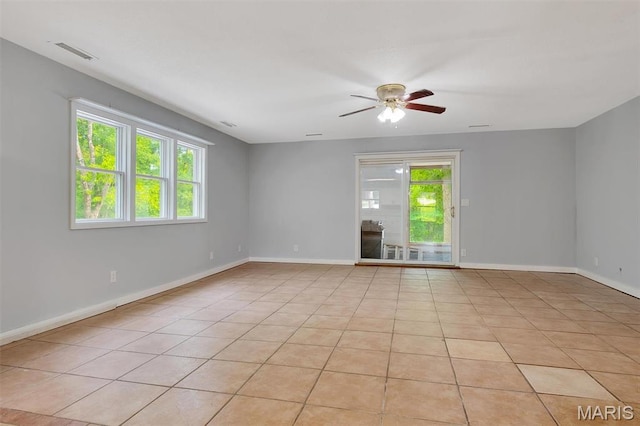 3080 Westwood Rd, Saint Clair, MO 63077 - unfurnished room featuring plenty of natural light, a ceiling fan, and light tile patterned flooring