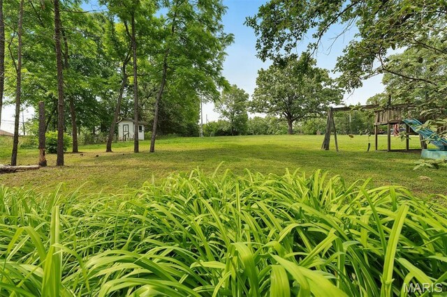 3080 Westwood Rd, Saint Clair, MO 63077 - view of grassy yard with a playground and a shed